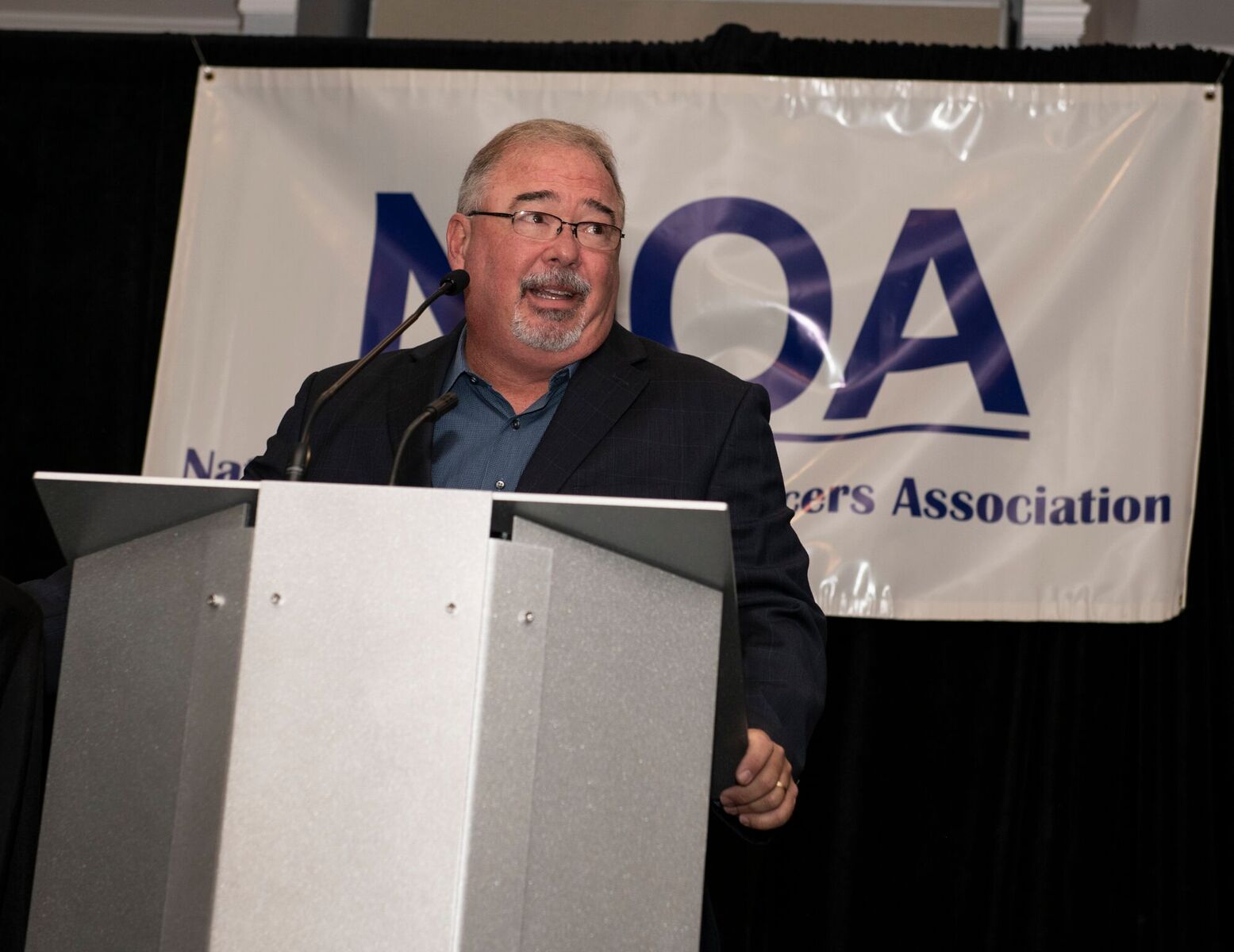 image of Don Aaron speaking at conference